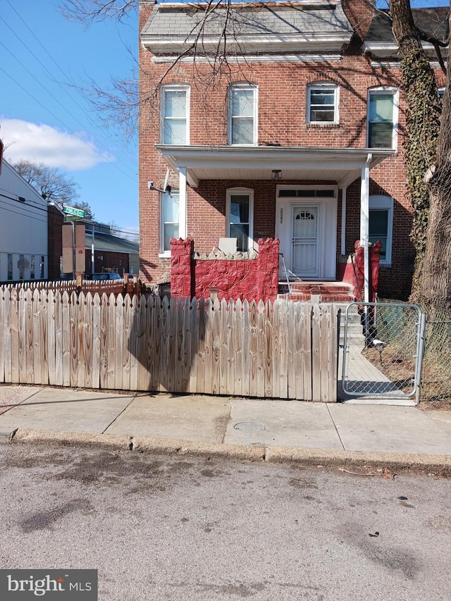 townhome / multi-family property with covered porch