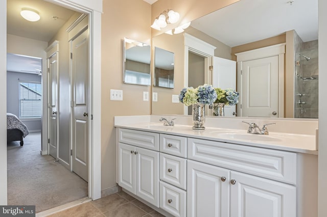 bathroom featuring tile patterned flooring and vanity