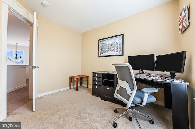 carpeted office space with a notable chandelier