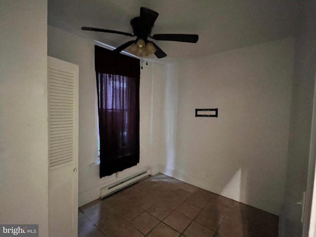 entrance foyer featuring tile patterned flooring, a baseboard radiator, and ceiling fan