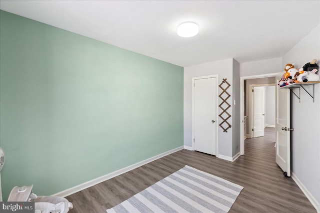 unfurnished bedroom featuring dark hardwood / wood-style floors