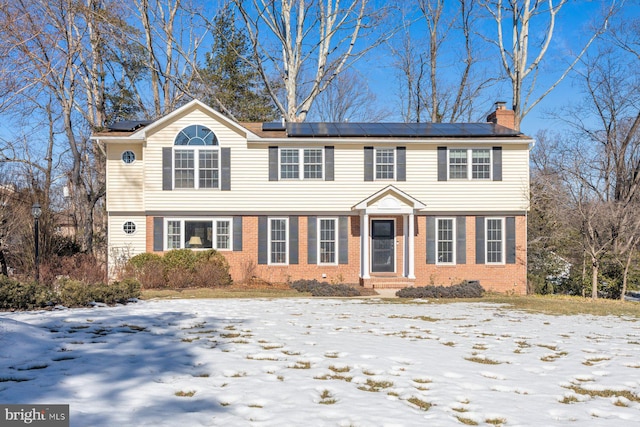 colonial inspired home with solar panels