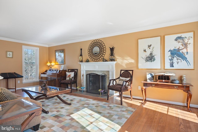 living room featuring wood-type flooring and ornamental molding