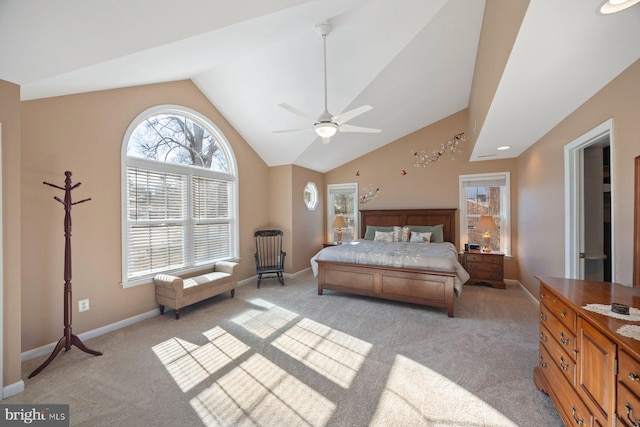 carpeted bedroom featuring high vaulted ceiling and ceiling fan