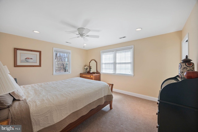 bedroom featuring light colored carpet and ceiling fan