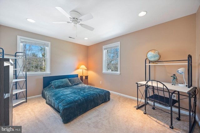 bedroom with light carpet and ceiling fan