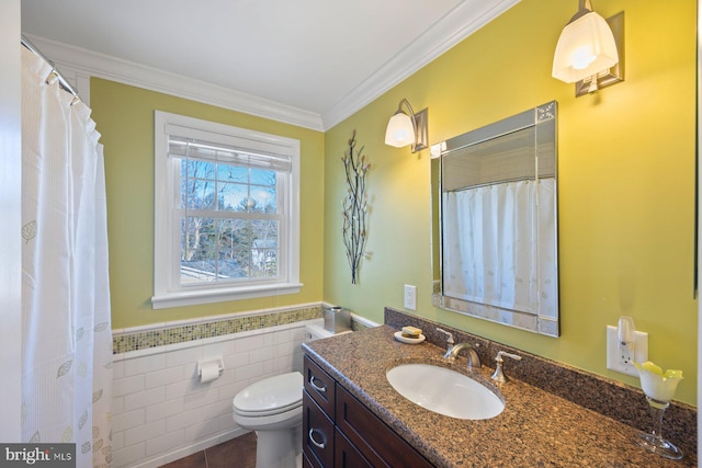 bathroom featuring crown molding, tile walls, vanity, tile patterned floors, and toilet