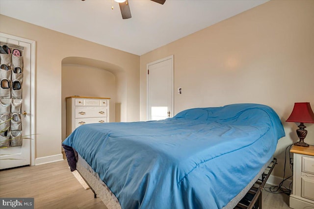 bedroom with ceiling fan and light hardwood / wood-style floors