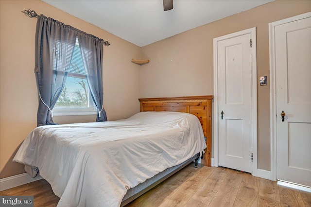 bedroom featuring ceiling fan and light hardwood / wood-style flooring