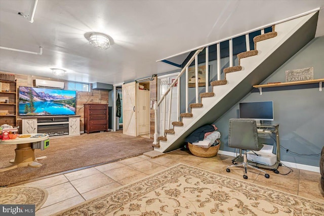 basement featuring a wall mounted air conditioner and carpet