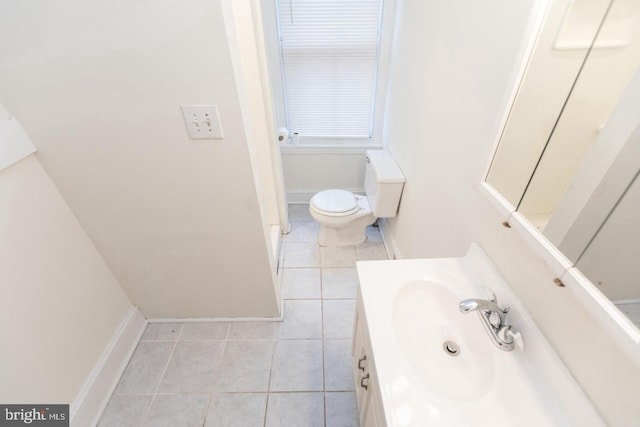 bathroom featuring vanity, toilet, and tile patterned flooring