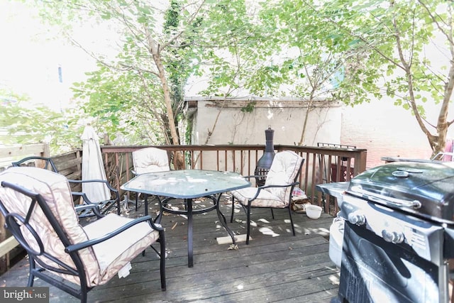 wooden deck featuring grilling area