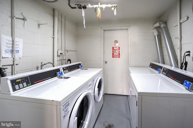 laundry area with independent washer and dryer