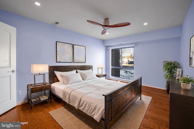 bedroom with ceiling fan and wood-type flooring