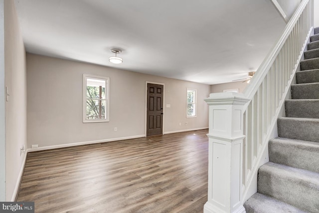 foyer with wood-type flooring and ceiling fan