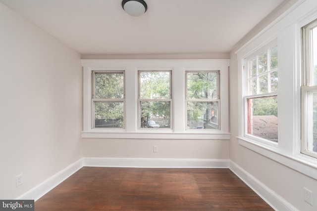 unfurnished sunroom featuring a wealth of natural light