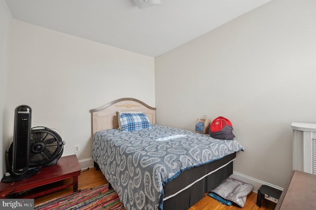 bedroom featuring wood-type flooring