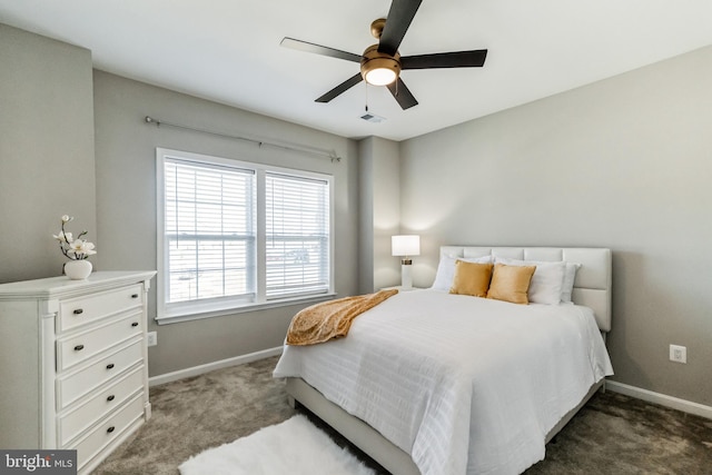 bedroom featuring dark colored carpet and ceiling fan