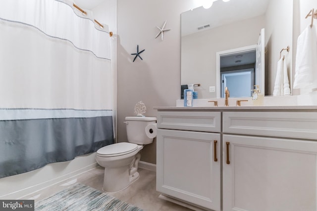 full bathroom featuring vanity, toilet, tile patterned flooring, and shower / bath combo