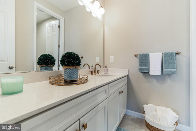 bathroom with vanity and tile patterned flooring