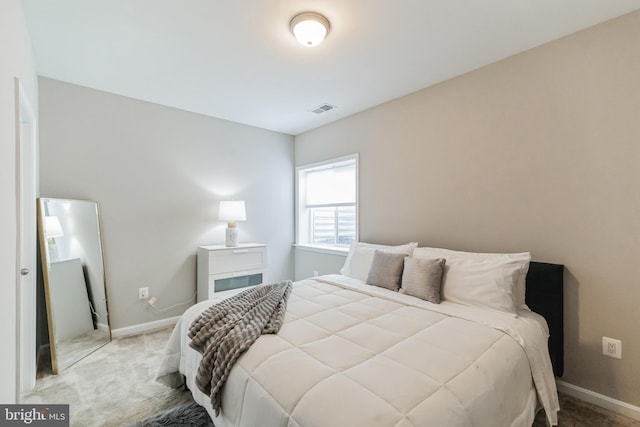 bedroom with light carpet