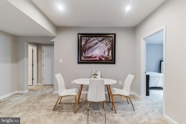 view of carpeted dining space