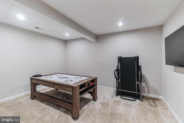 carpeted bedroom with beamed ceiling