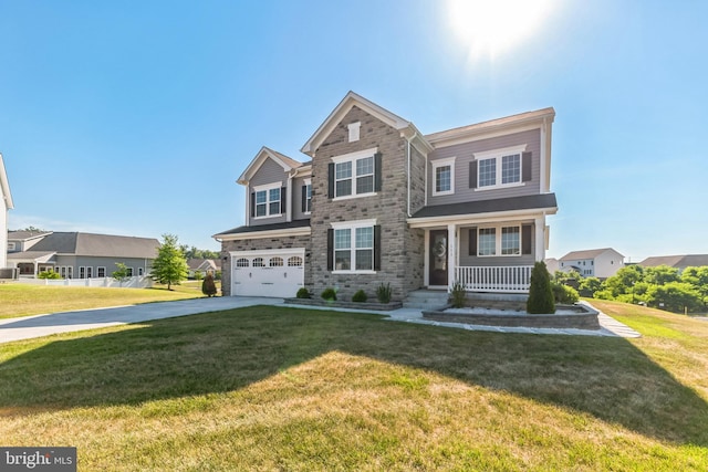 view of front of property with a garage, a front lawn, and a porch