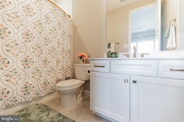 full bathroom featuring vanity, toilet, and shower / tub combo