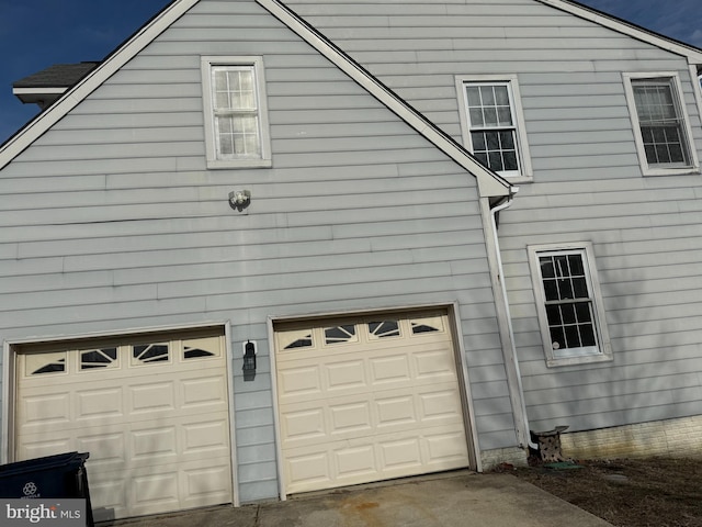 view of property exterior featuring a garage