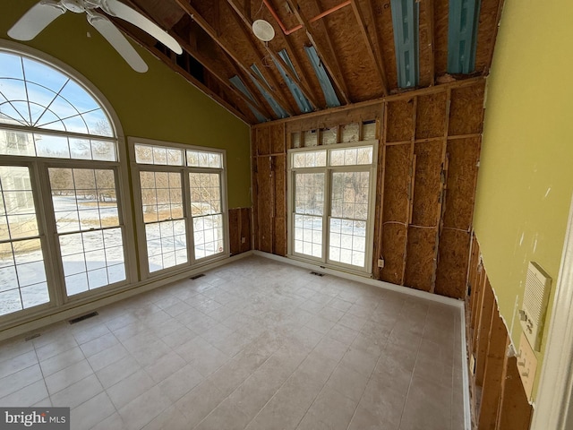 unfurnished sunroom with ceiling fan