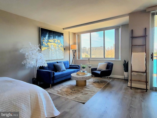 bedroom featuring baseboards and wood finished floors