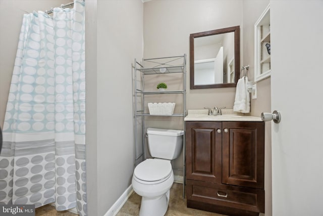 bathroom with walk in shower, vanity, and toilet