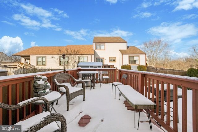 view of snow covered deck