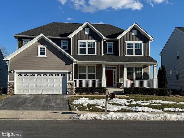 view of front of house featuring a garage and covered porch