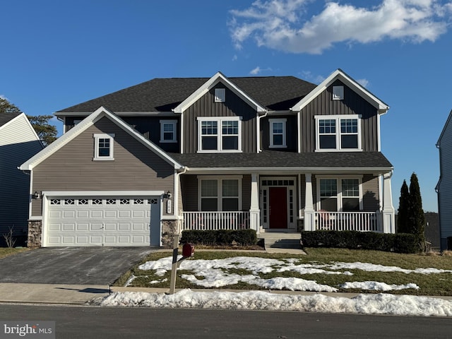 view of front of home with a garage and covered porch