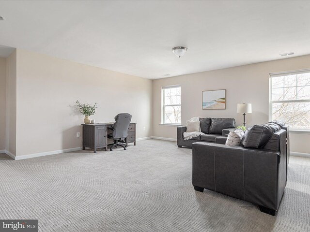 living room featuring light carpet