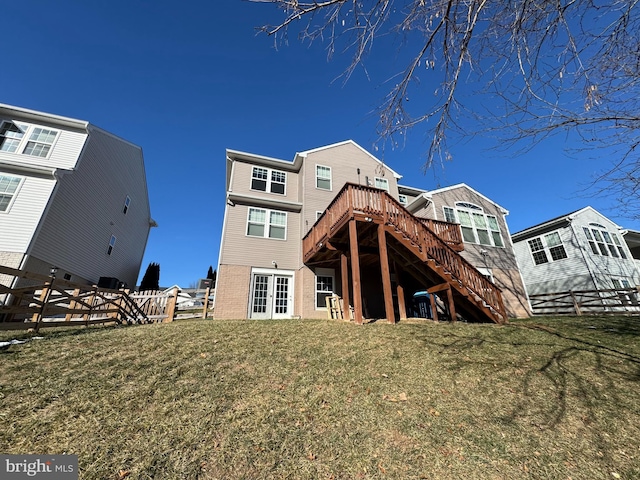 rear view of property featuring a yard