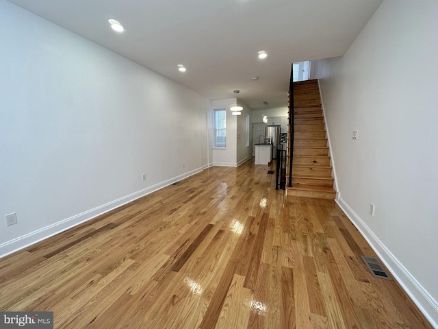 unfurnished living room featuring light hardwood / wood-style floors