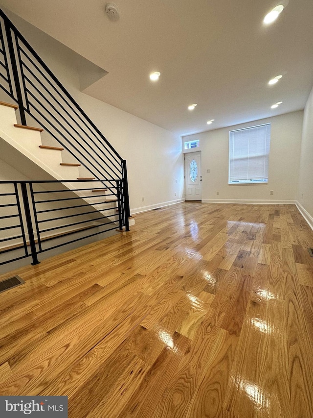 unfurnished living room featuring light wood-type flooring