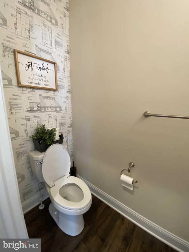 bathroom featuring hardwood / wood-style floors and toilet