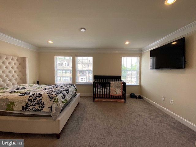 bedroom featuring crown molding and carpet