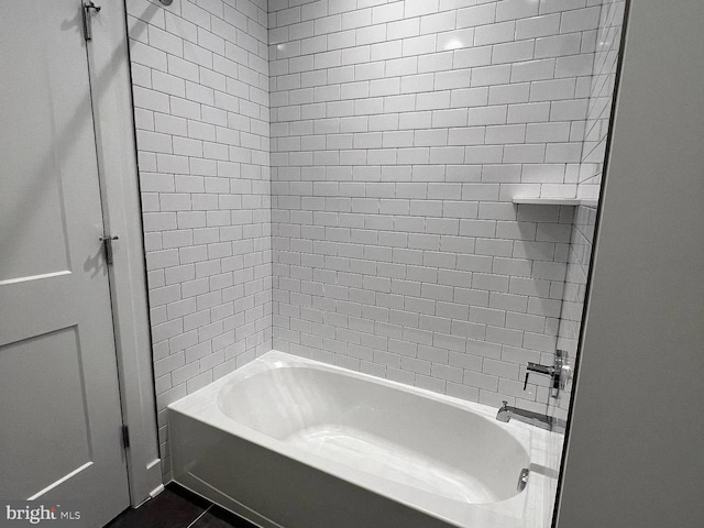 bathroom with tile patterned flooring and shower / bathing tub combination