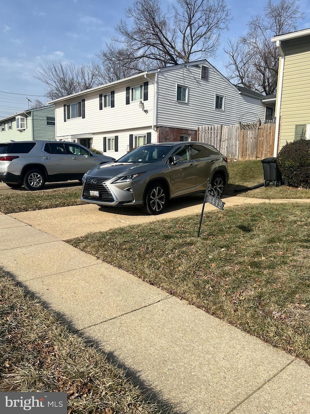 view of side of home with a lawn