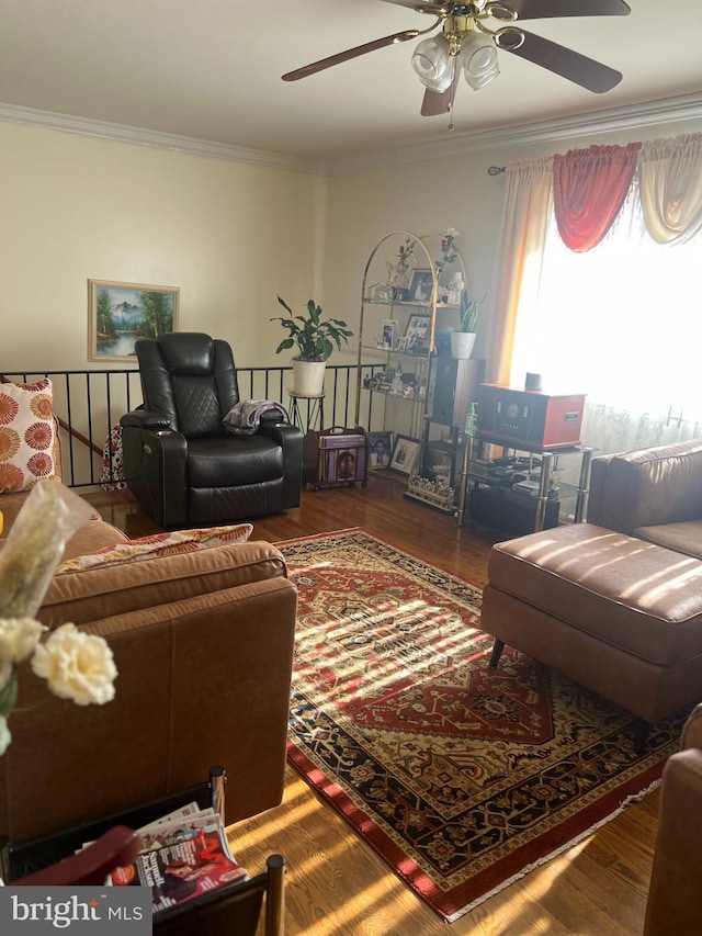 living room featuring crown molding and hardwood / wood-style floors