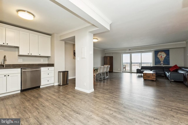 kitchen featuring white cabinets, crown molding, hardwood / wood-style floors, and dishwasher