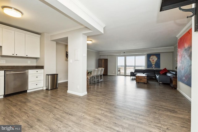 kitchen with dishwasher, hardwood / wood-style floors, white cabinets, and crown molding