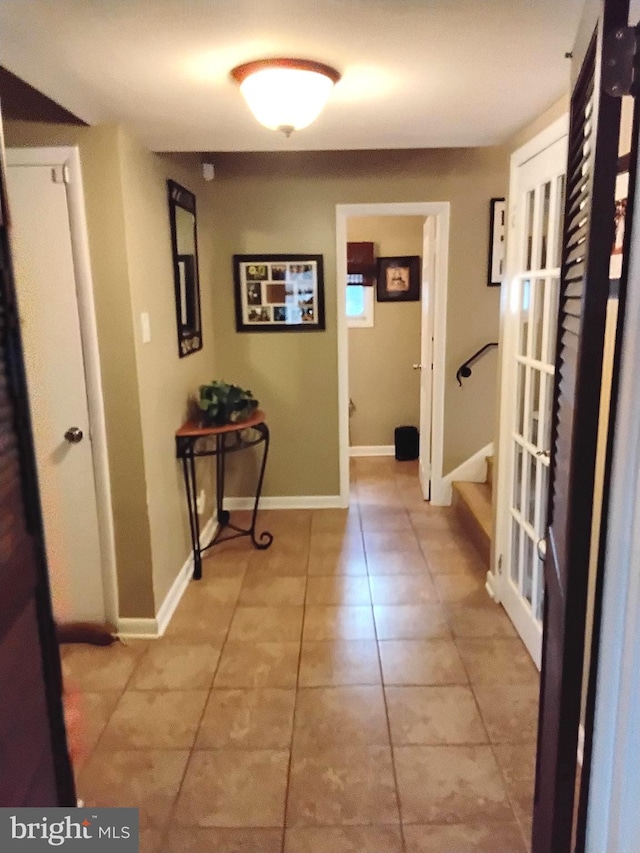 hallway featuring light tile patterned flooring