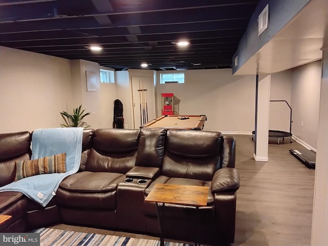 cinema room with wood-type flooring