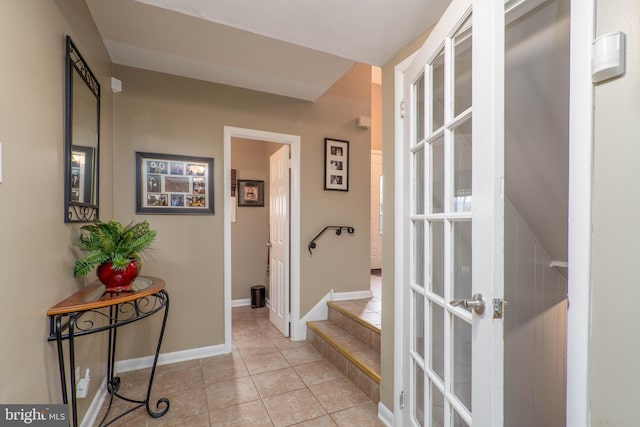 hallway featuring light tile patterned floors